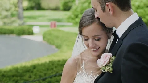 Wedding couple in the park Stock Footage 103950599