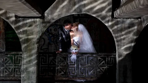 Wedding couple under the bridge Stock Footage 70069990