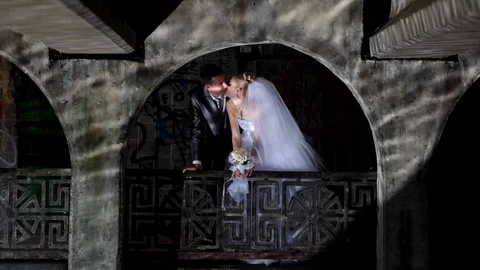 Wedding couple under the bridge Stock Footage 70070262