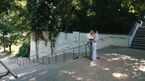 Wedding couple at a walk in the park. Stock Footage 107657053