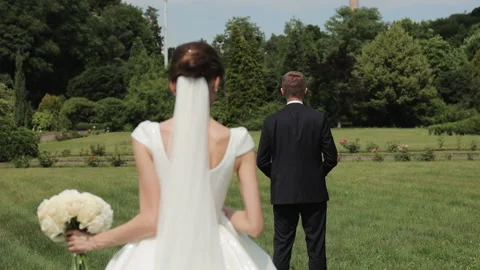Wedding couple walking with beautiful park. Young couple in love they embrace Stock Footage 196006161