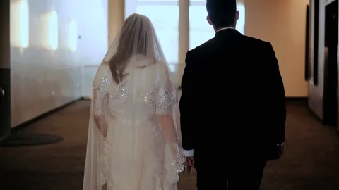 Wedding couple walking in building Stock Footage 100986336