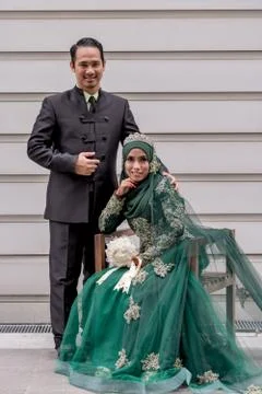 Wedding couples poses for outdoor shooting for wedding album Stock Photos