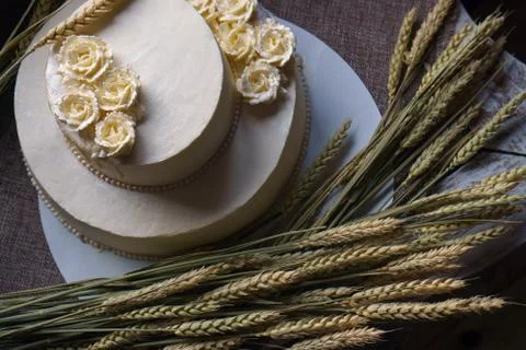 Wedding cream cake on rustic background. Beautiful Gourmet tart decorated with Stock Photos