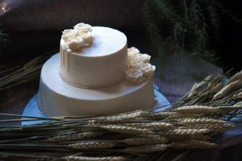 Wedding cream cake on rustic background. Beautiful Gourmet tart decorated with Stock Photos