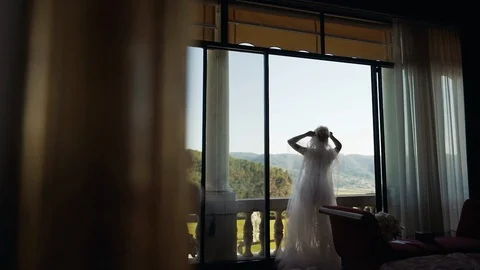 Wedding Day. Bride Looks At The Window. Video stock 104868267