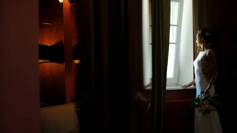 Wedding Day. Bride Looks At The Window. Video stock 111782636