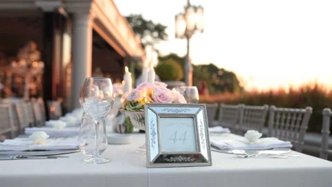 Wedding day dinner table in hotel garden white close up. Wedding day table Stock Footage 134349731
