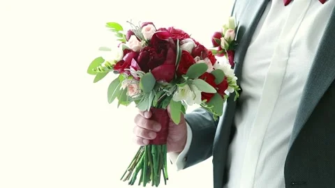 On a wedding day the groom strokes the bride's hand, the wedding bouquet 스톡 동영상 86604635