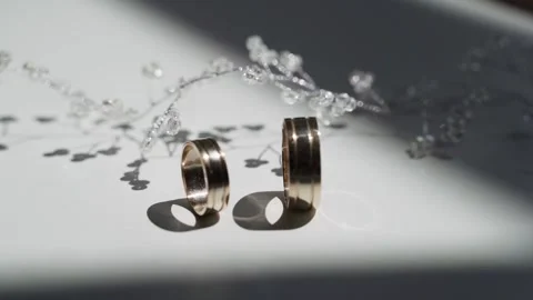 Wedding decor and two gold wedding rings Stock Footage 172192575