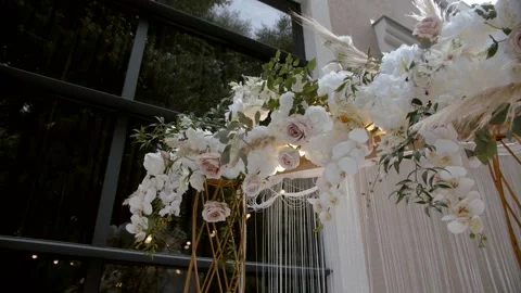 Wedding decor. Area of the wedding ceremony. Arch decorated with flowers. Stock Footage 164596373