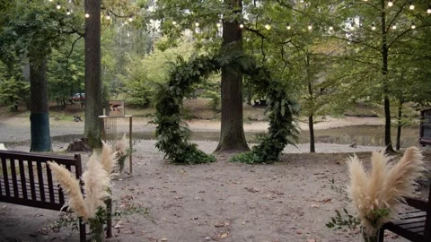 Wedding decor. Area of the wedding ceremony. Arch decorated with green. Stock Footage 257119877