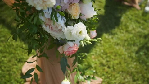 Wedding decor. Beautiful wedding arch with fresh flowers in the garden on a Stock Footage 143251935