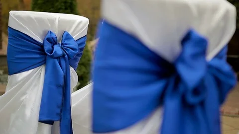 Wedding decor. the bows on the chairs. Stock Footage 75538879