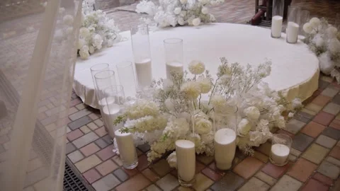 Wedding decor with candles and white flowers. Stock Footage 257618909