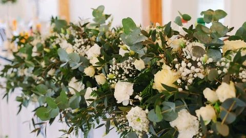 Wedding Decor.The Design of the Wedding Decorations. Flowers on the table Stock Footage 104924560