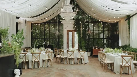 Wedding decor. Elegant Indoor Event Space, featuring Lush Greenery and Modern Stock Footage 306150304