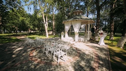 Wedding decoration, wedding reception set outdoors under bright sun on resort Stock Footage 95859261