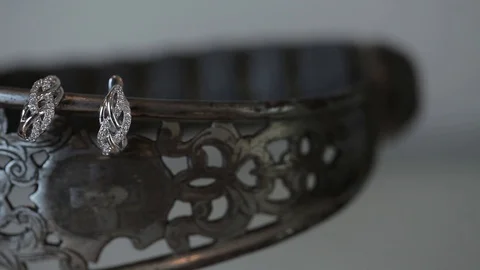 Wedding decorations for the bride Sword sword and earrings Bijouterie, ribbons Stock Footage 95046795