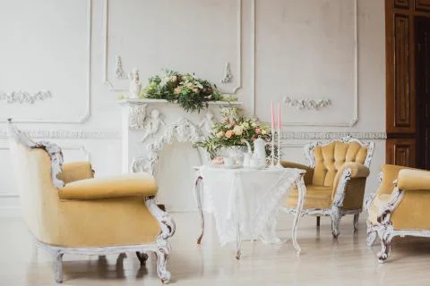 Wedding decorations zone - white table with bouquet and cupcakes Stock Photos