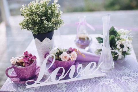 Wedding decorative elements on a table for a couple in love Fotos Stock