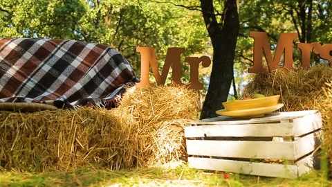 Wedding different decor, straw. Outdoors wedding ceremony, focus, closeup. Stock Footage 82979428