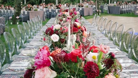 Wedding dining table. Rustic wedding. Rouquet of roses. Colorful flowers. Stock Footage 125193282