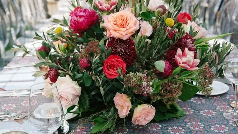 Wedding dining table. Rustic wedding. Rouquet of roses. Colorful flowers. Stock Footage 125269834