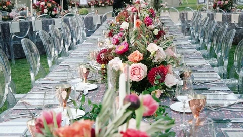Wedding dining table. Rustic wedding. Rouquet of roses. Colorful flowers. Stock Footage 125270023