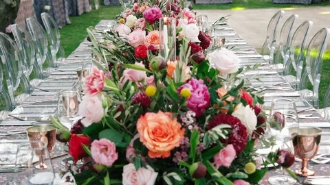 Wedding dining table. Rustic wedding. Rouquet of roses. Colorful flowers. Stock Footage 125270450