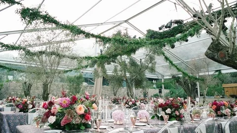 Wedding dining table. Rustic wedding. Rouquet of roses. Colorful flowers. Stock Footage 125275608