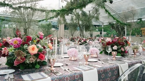 Wedding dining table. Rustic wedding. Rouquet of roses. Colorful flowers. Stock Footage 125276335