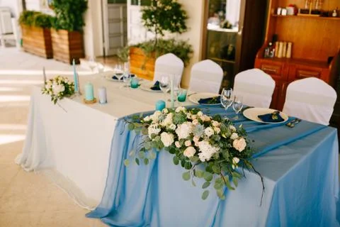 Wedding dinner table reception. Decoration of the table newlyweds with white and Stock Photos