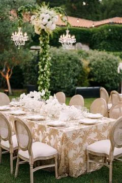 Wedding dinner table reception. Elegant tables for guests with cream tablecloths Stock Photos