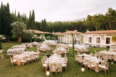 Wedding dinner table reception. Elegant tables for guests with cream tablecloths 写真素材
