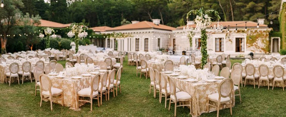 Wedding dinner table reception. Elegant tables for guests with cream tablecloths 写真素材