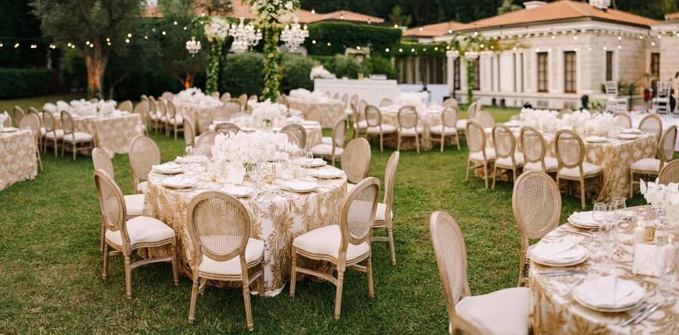 Wedding dinner table reception. Elegant tables for guests with cream tablecloths 写真素材