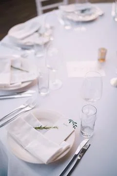 Wedding dinner table reception. White plate with cloth towel with paper menu and Stock Photos