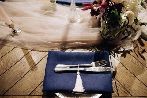 Wedding dinner table setting with silver knife and fork Stock Photos
