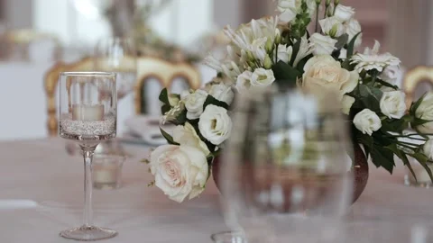 Wedding dinning table decoration flowers glasses Stock Footage 171165597