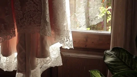 Wedding dress on the background of the window Stock Footage 71368784