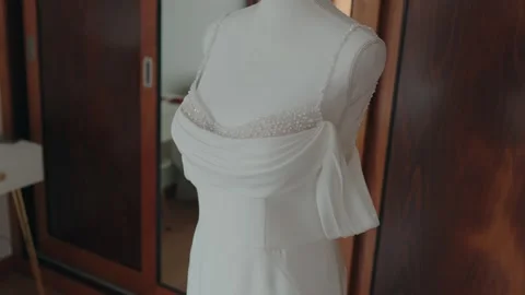 Wedding dress displayed on mannequin inside room Stock Footage 328956937