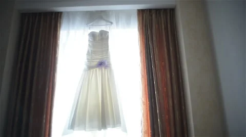Wedding dress in front of the window 库存影片 59975427