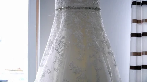 Wedding dress hanging on the window 스톡 동영상 88358854
