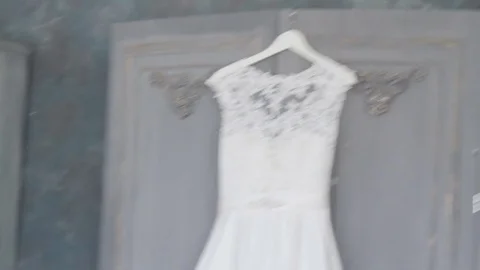 Wedding dress hangs on hangers close-up Stock Footage 73291153