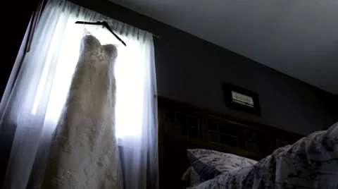 Wedding Dress Hung in a Window Stock Footage 45937606