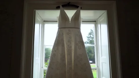 Wedding dress in window 1 Stock Footage 170932285