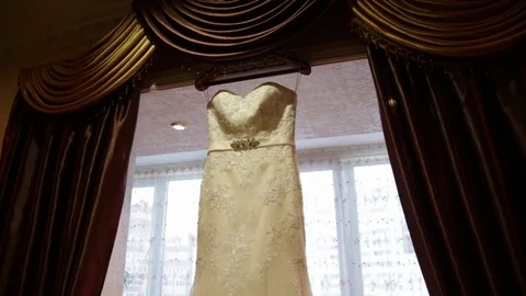 Wedding dress on window background Stock Footage 81320091