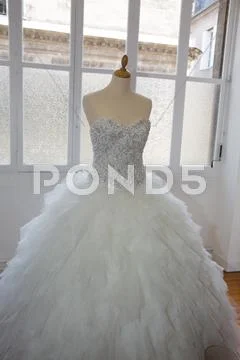 Wedding dresses in bridal salon on mannequin Stock Photos