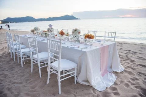 Wedding The elegant dinner table on the beach Stock Photos